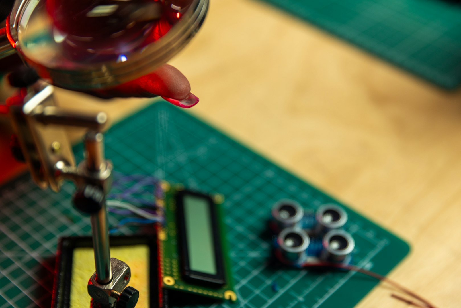 Engineers analyzing blueprints and components, developing a cutting-edge robotics project in a technologically advanced workspace